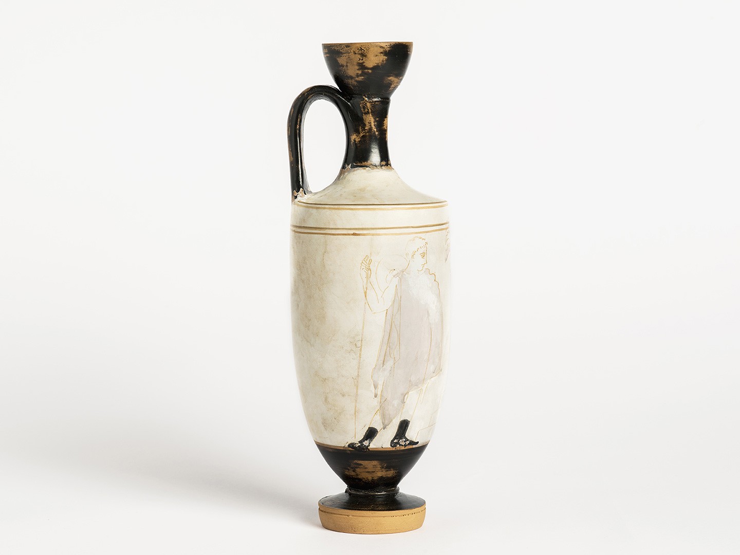 Type of perfume vase or white lekythos. This ceramic vessel was used for storing perfumes or oil.