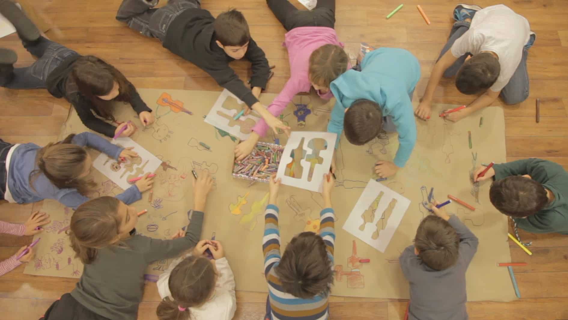 group of children drawing together