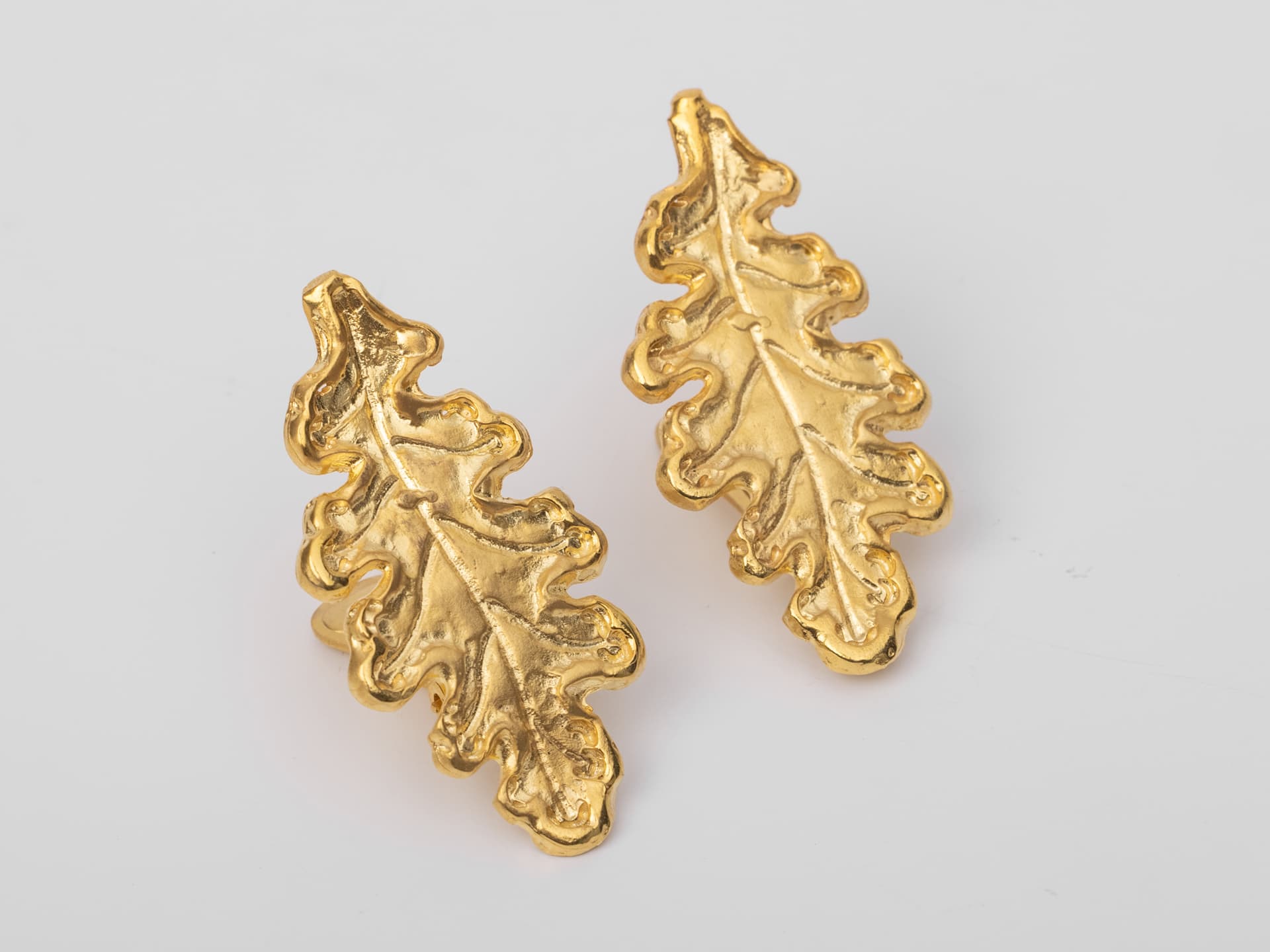 gold plated earrings in the shape of oak leaves