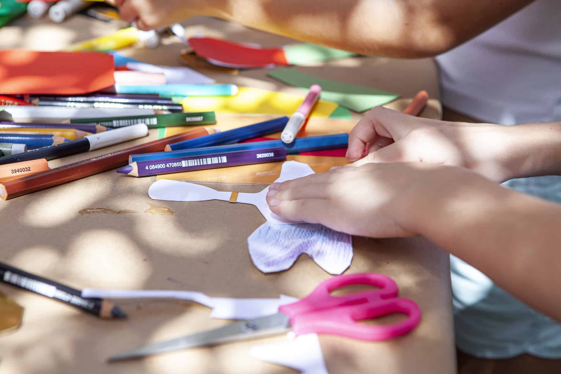 children's activity with painting and paper construction