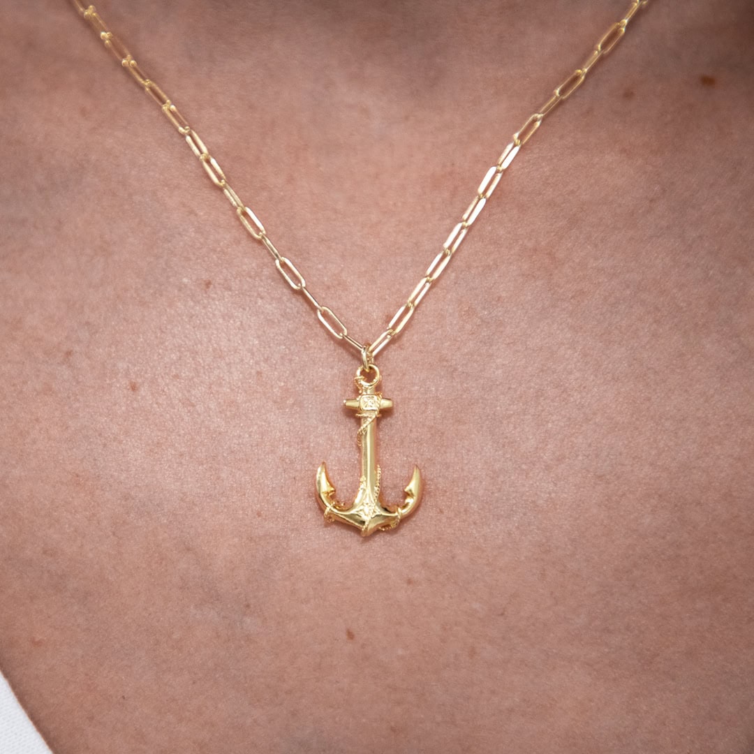 Gold plated necklace with an anchor.