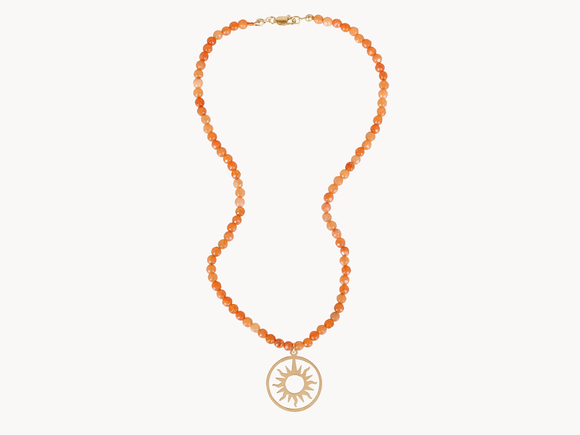 Necklace orange jade with rounded helios.