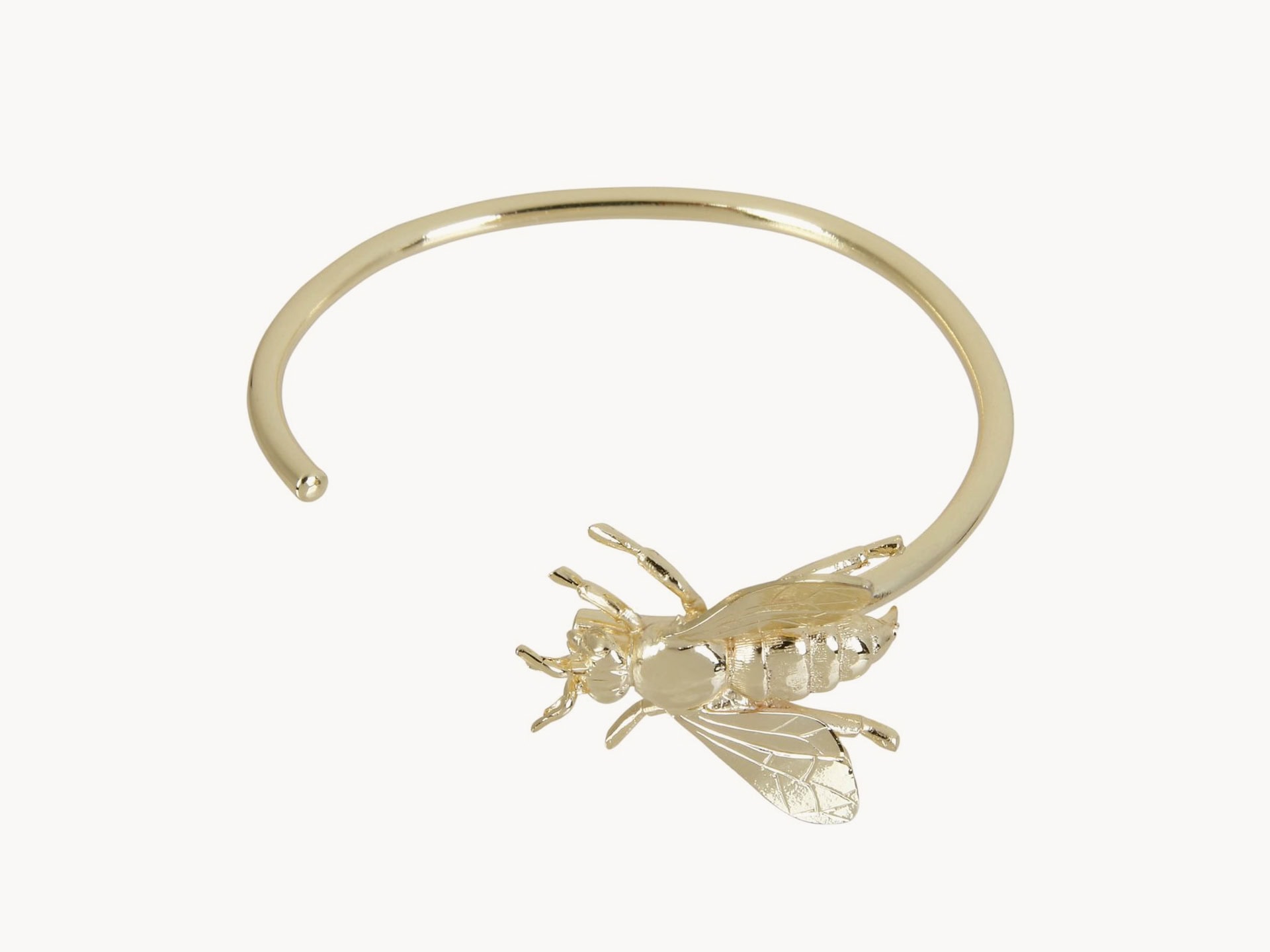 Gold plated bracelet with a bee.